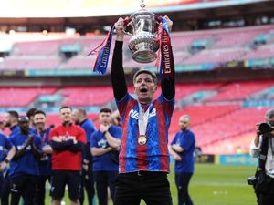 Crystal Palace manager Oliver Glasner lifts the FA Cup