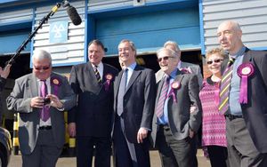 UKIP leader Nigel Farage with party members and supporters during a visit to the Bird and Yates Vehicle Repair Centre, in Brookfield Drive, Cannock