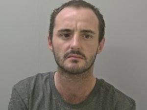 Supporting image for story: Drug dealer who played a "significant role" was caught in a hotel room with hundreds of pound in cash, cocaine and heroin