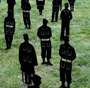The figures features soldiers, airmen, and sailors of all faiths and creeds