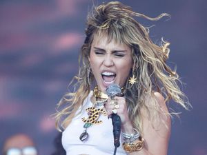 Supporting image for story: Miley Cyrus got ‘brutal infection’ after rolling around on Walk of Fame for film