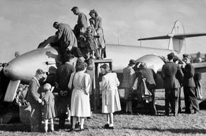 Crowds checking out a Meteor jet fighter