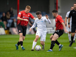 ​Rhys Hilton finds himself outnumbered as he looks for a route to goal Picture: Kieran Stoddart