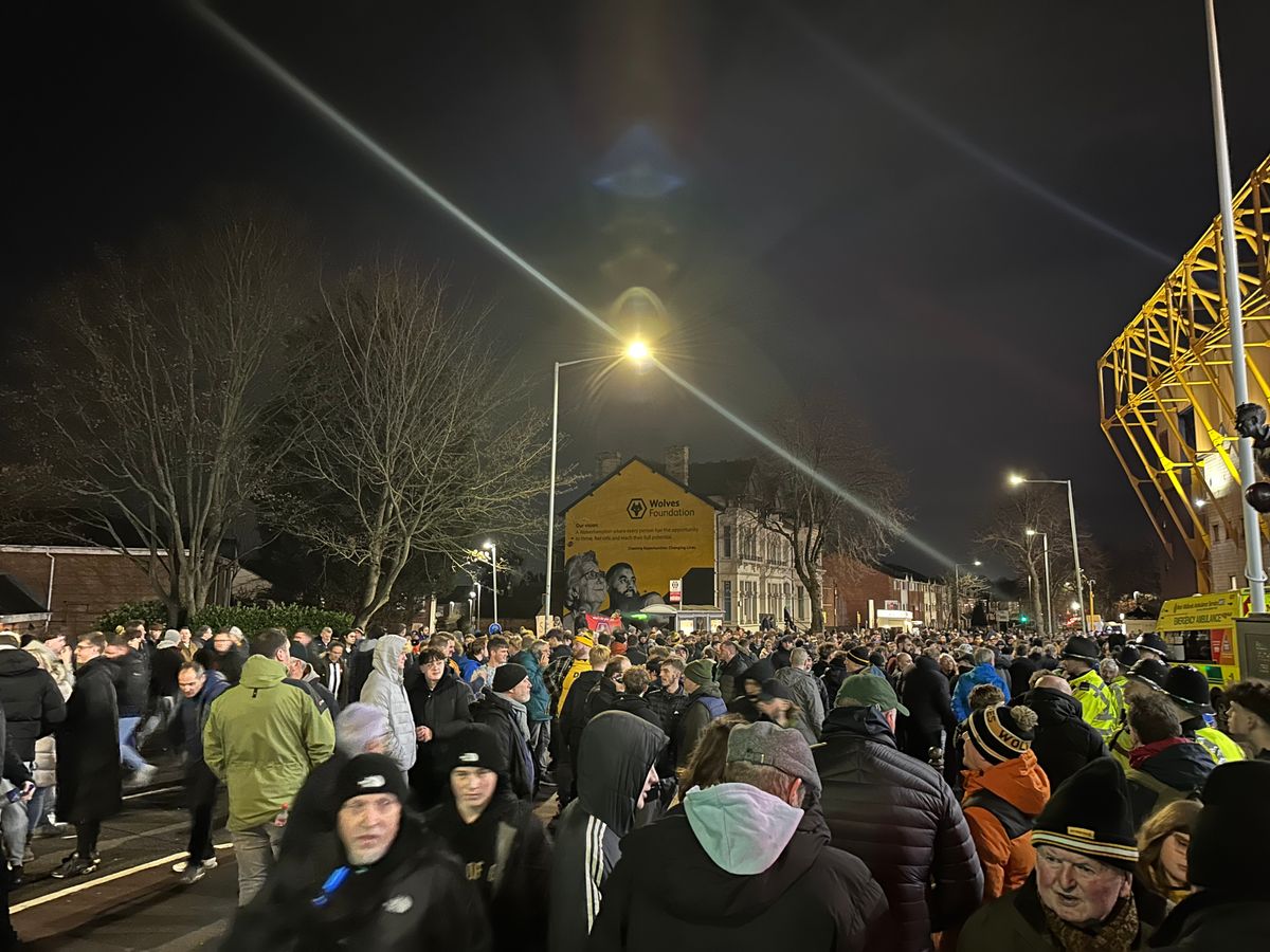 Wolves fans protest during Premier League match against Manchester United