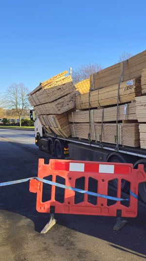 A picture taken at around 2.30pm on Monday shows the wood leaning signficantly to the side of the lorry