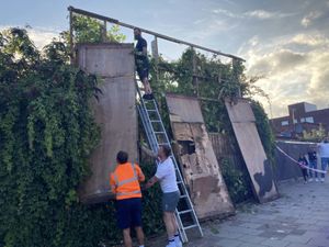 Supporting image for story: Crowds boo as sixth Banksy artwork of cat removed hours after being unveiled