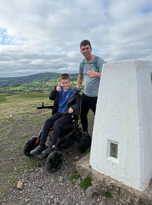 Pupil Myles at the top of the hill with dad Andy O'Brien. Picture: Pontesbury Primary School
