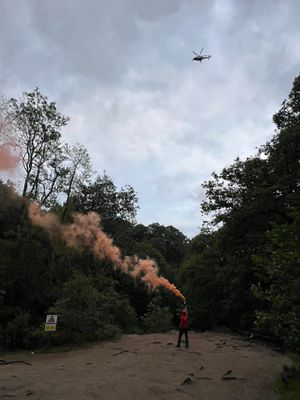 Rescuers signalling to a helicopter. Picture: Central Beacons Mountain Rescue Team