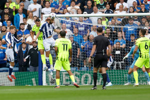Nat Phillips heads clear for West Bro against Portsmouth (Photo by Adam Fradgley/West Bromwich Albion FC via Getty Images)