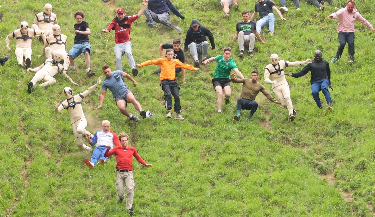 Watch the drama as dozens of daredevils join the 2025 Cheese Rolling chase near Gloucestershire