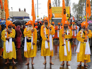Supporting image for story: Dazzling colours shine as parade hits streets