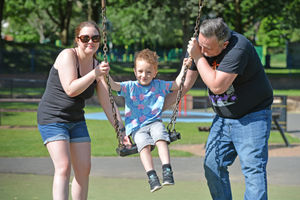 Kay, Killian, aged four, and Matt Dore enjoy the hot weather.