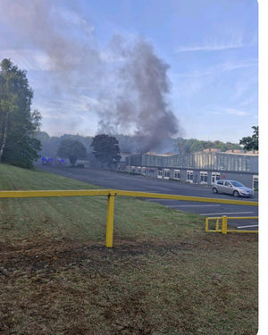 Plumes of smoke rising from the industrial estate