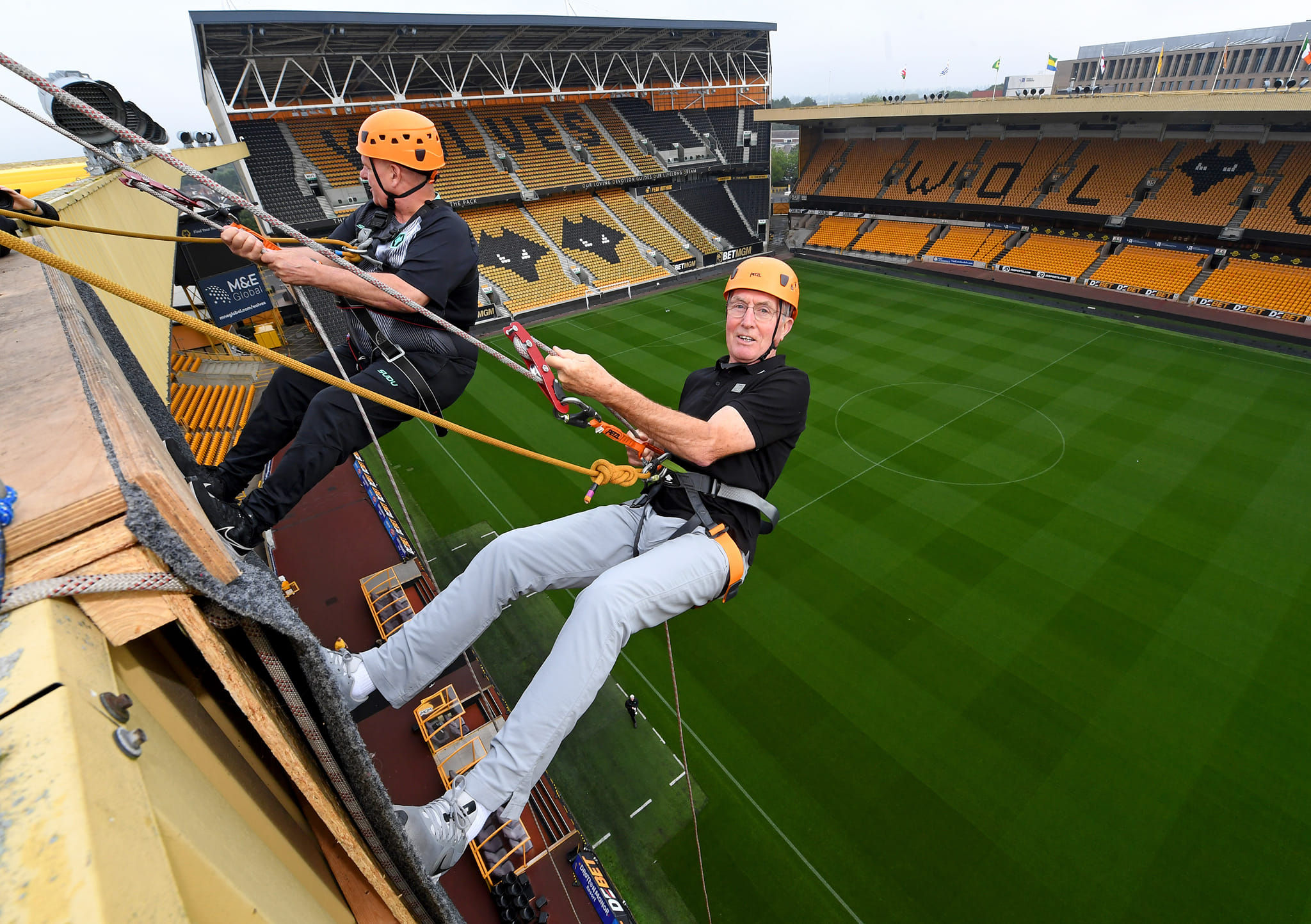 John Richards at last year's Abseil with Wolves Foundation Health Officer Steve Maiden. 
