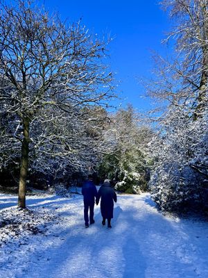 A couple take a stroll in the snow in Ellesmere.