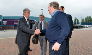 Alan Irvine is greeted by a supporter, right, as he is unveiled as the new Baggies head coach