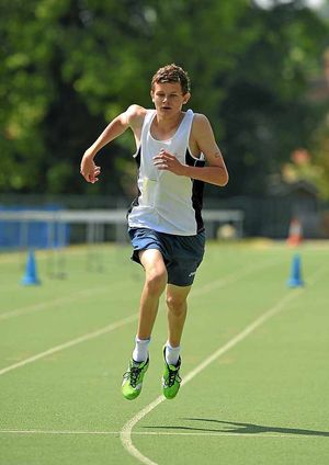 Biathlon competitor Matthew Griffiths, from William Brookes School, crosses the line to finish his 1000m run