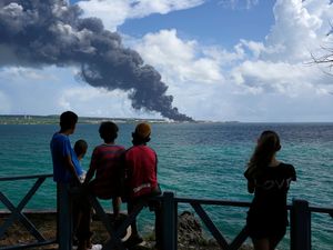 Supporting image for story: Dozens injured as lightning strike starts fire at Cuban oil storage facility