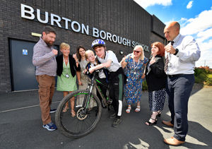 Chris Doyle with sister Afiya, aged 12, and staff members