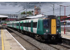 A London Northwestern train in green and white livery