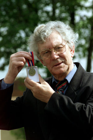 Bill Archer with his wartime medal