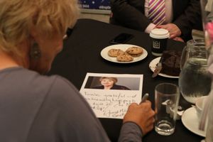 Annette signing a photo for staff at Birmingham's Old Rep Theatre