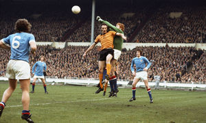 Manchester City goalkeeper Keith MacRae punches clear from the head of Wolves striker Derek Dougan during the 1974 League Cup Final at Wembley Stadium (Photo by Don Morley/Allsport/Getty Images)