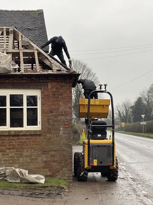 Inspectors had taken action after two men were seen accessing a roof from the bucket of an excavator. Photo: HSE