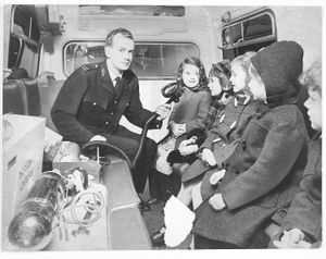 Chadsmoor Infants School, Cannock. The school was running a project about "people who help us" and visited ambulance headquarters in Stafford. The photograph shows Deputy Station Officer Nevil Haughton demonstrating oxygen equipment to the children on January 30, 1974.