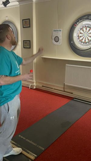 Kevin playing on the oche. Photo: Kevin Owens