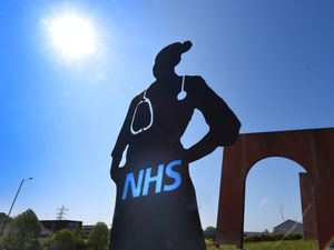 Supporting image for story: How nurse sculpture has become new landmark on Cinder Bank island