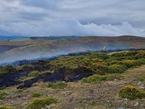 Supporting image for story: Firefighters spend hours tackling blaze after fire under tractor spreads on Long Mynd