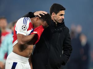 Arsenal manager Mikel Arteta (right) consoles player Jurrien Timber