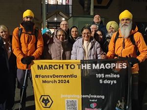Supporting image for story: Watch: Father and son cheered by supporters as they begin charity trek from Molineux