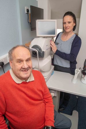 VIP guest, Malcolm Lloyd, officially declared the revamped Scrivens Opticians & Hearing Care branch in Leominster open for business and was the first to try the new OCT scanner