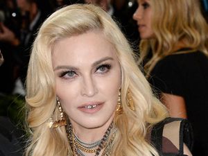 Supporting image for story: Madonna postpones tour after spending several days in intensive care