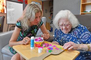 Lisa Cowley joins Doreen Evans in the communal lounge
