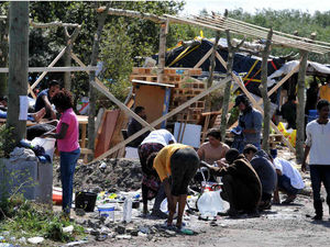 Supporting image for story: Volunteers overwhelmed by aid donations for Calais refugees