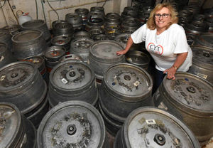 Jane Ward of Central Youth Theatre surrounded by barrels