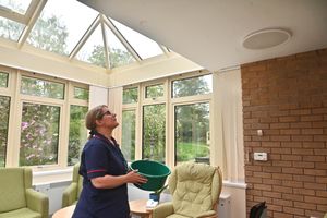 Ward Manager Zoe Thomas with one of the buckets they use when there is a leak.