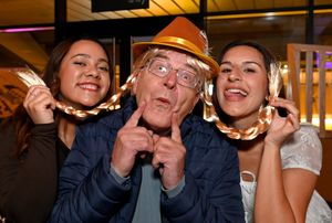 .Athea Jones, Martin Astley, and Sabrina Uppal enjoying the Oktoberfest party.