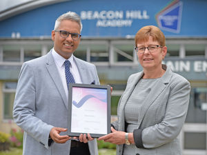 Supporting image for story: School learning manager receives national unsung hero award 