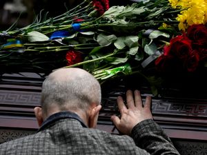 Supporting image for story: Hundreds gather in Kyiv for funeral of activist killed during invasion