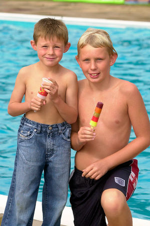 James Platt, 6, and Lewis Davies, 12, enjoying the weather at Swancote swimming pool near Wolverhampton in 2004