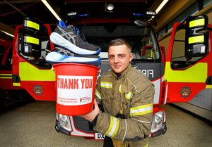 Firefighter Regan Williams is running the equivalent of five marathons to raise money for charity. Here he is pictured at Walsall fire station.