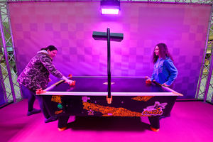 Tracie Newman and daughter Keira, aged 13, on the air hockey game