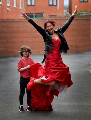 Debbie O'Kelly, from Lawley, Telford, who is going to run the London Marathon in her wedding dress to raise money for charity after her daughter Dulcie (holding the train) was given the all clear from cancer last year.