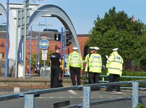 Police officers at the scene where the crash happened