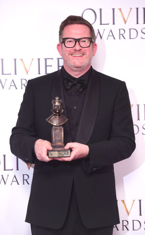 Matthew Bourne wins the Special Award presented by Darcy Bussell and Richard E Grant at the Olivier Awards at the Royal Albert Hall in London