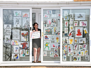 Supporting image for story: I need a hero: Hand-drawn window display spreads cheer in Stourport